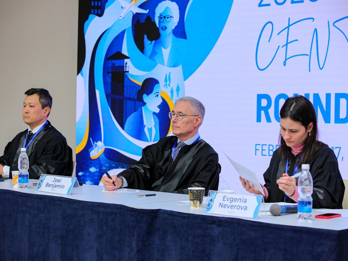 Three judges on the bench during the Central Asian Rounds