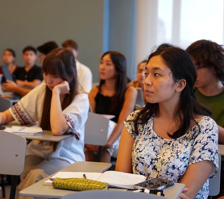 Students listening in a classroom during a Summer School lecture.
